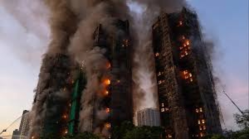 Seven people and two firms charged over Hong Kong deadly fire that killed 168